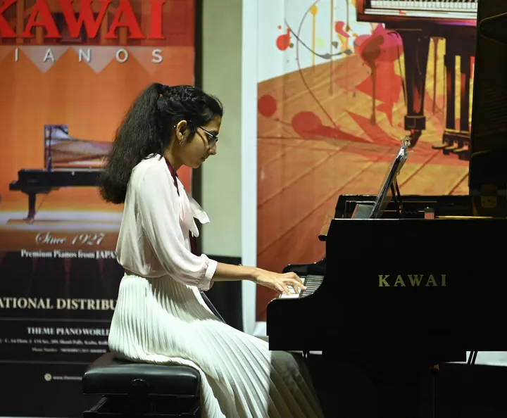 A student at the Kawai grand, Confluence 2025